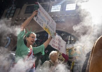 Marchers gather in worldwide protest of financial institutions “profiting off the climate crisis”