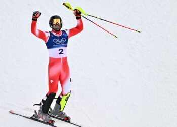 Loic Meillard withstands mercurial weather conditions to win slalom Olympic gold