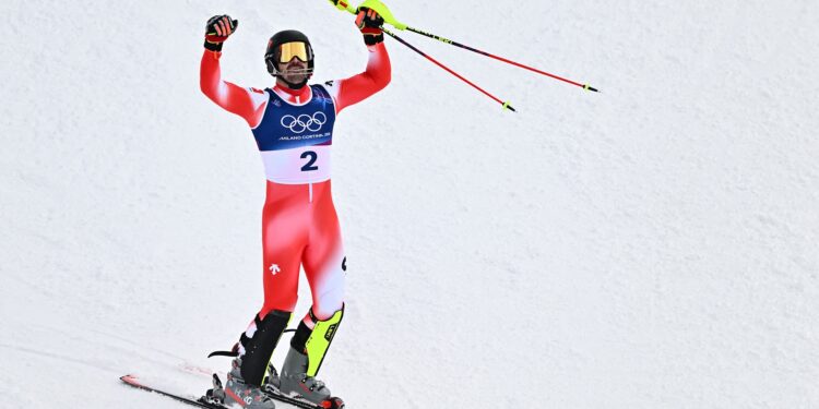 Loic Meillard withstands mercurial weather conditions to win slalom Olympic gold